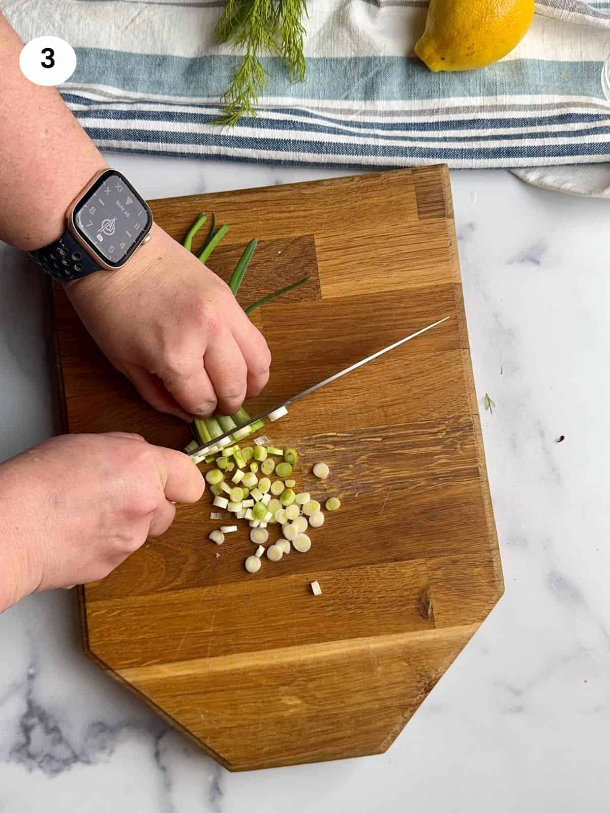 Chopping the green onions.