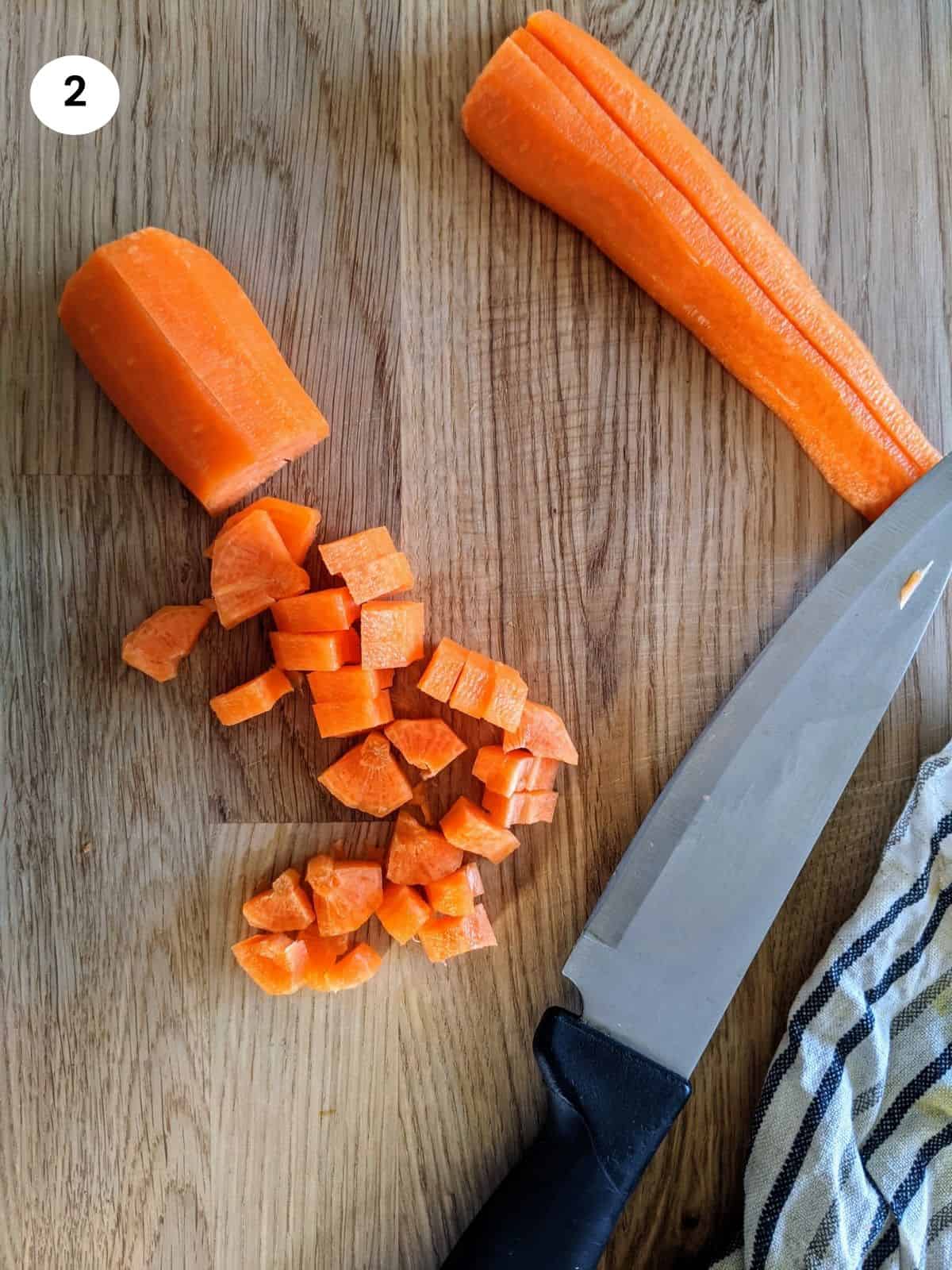 Chopping carrots for spinach and rice stew
