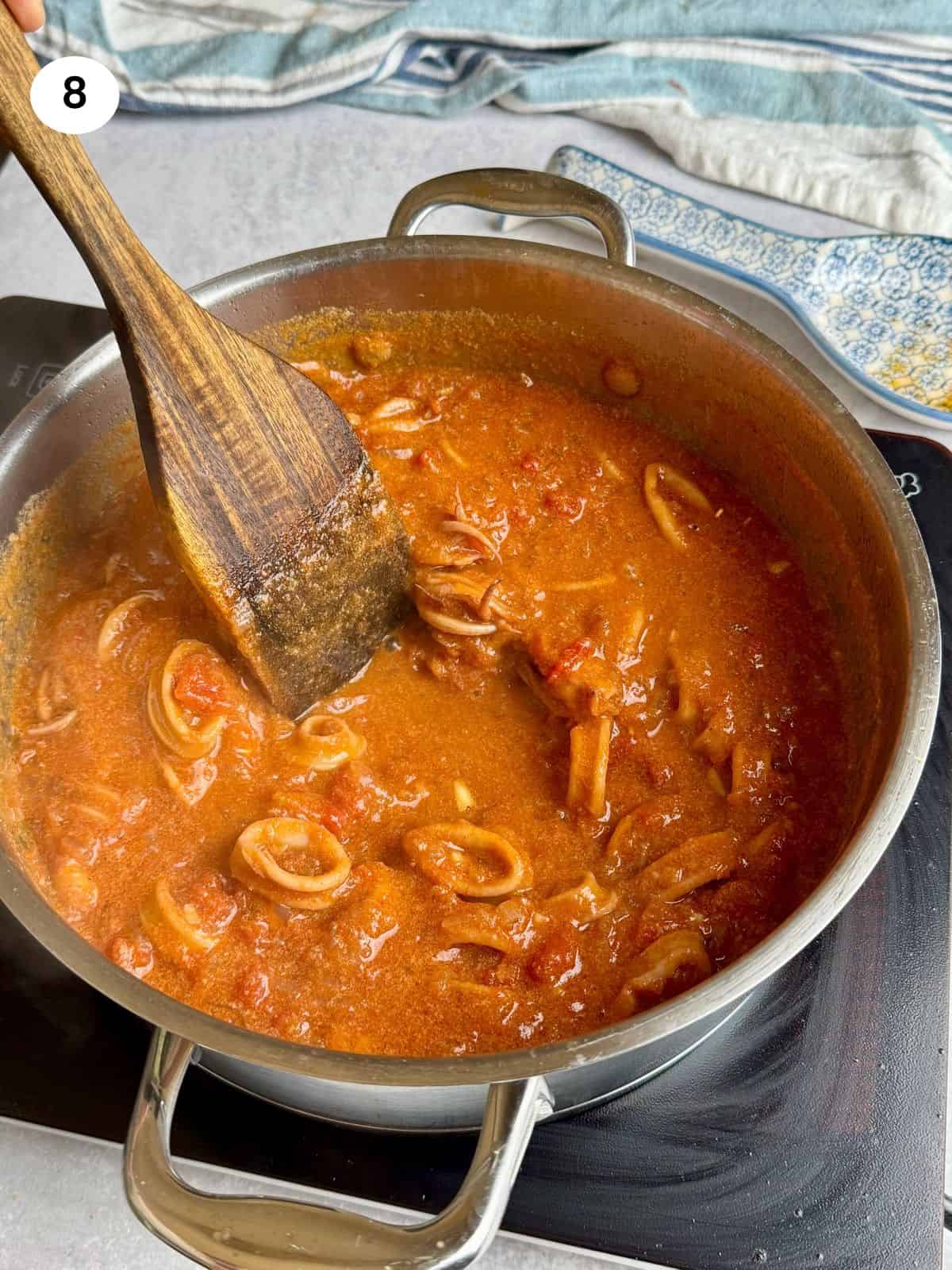 Sauce thickened and squid cooked.