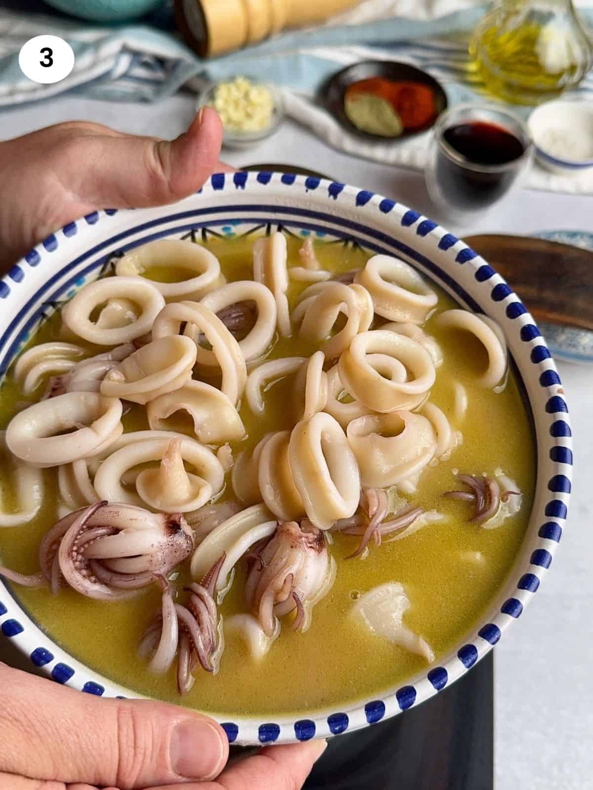 Squid with juices in a bowl.