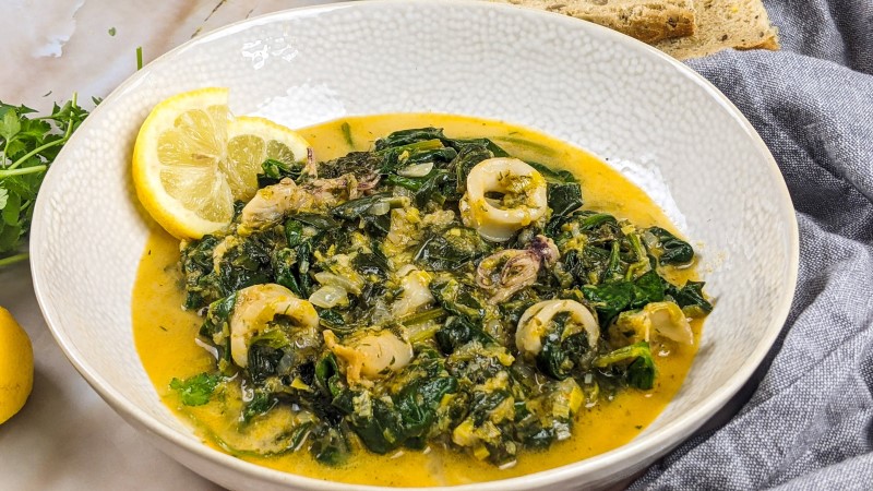 Served squid stew with spinach