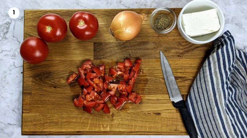 Preparing the tomatoes for strapatsada