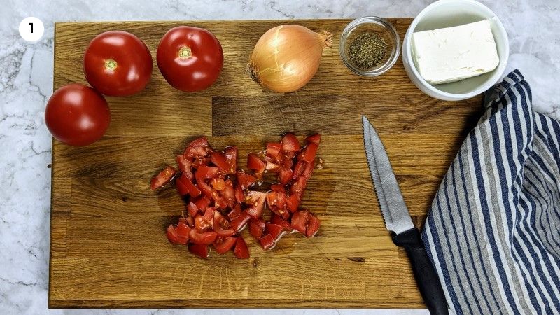 Preparing the tomatoes for strapatsada.