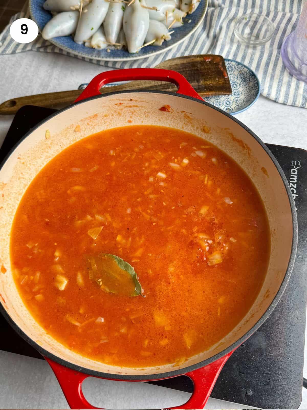 Making the tomato sauce in the pan.