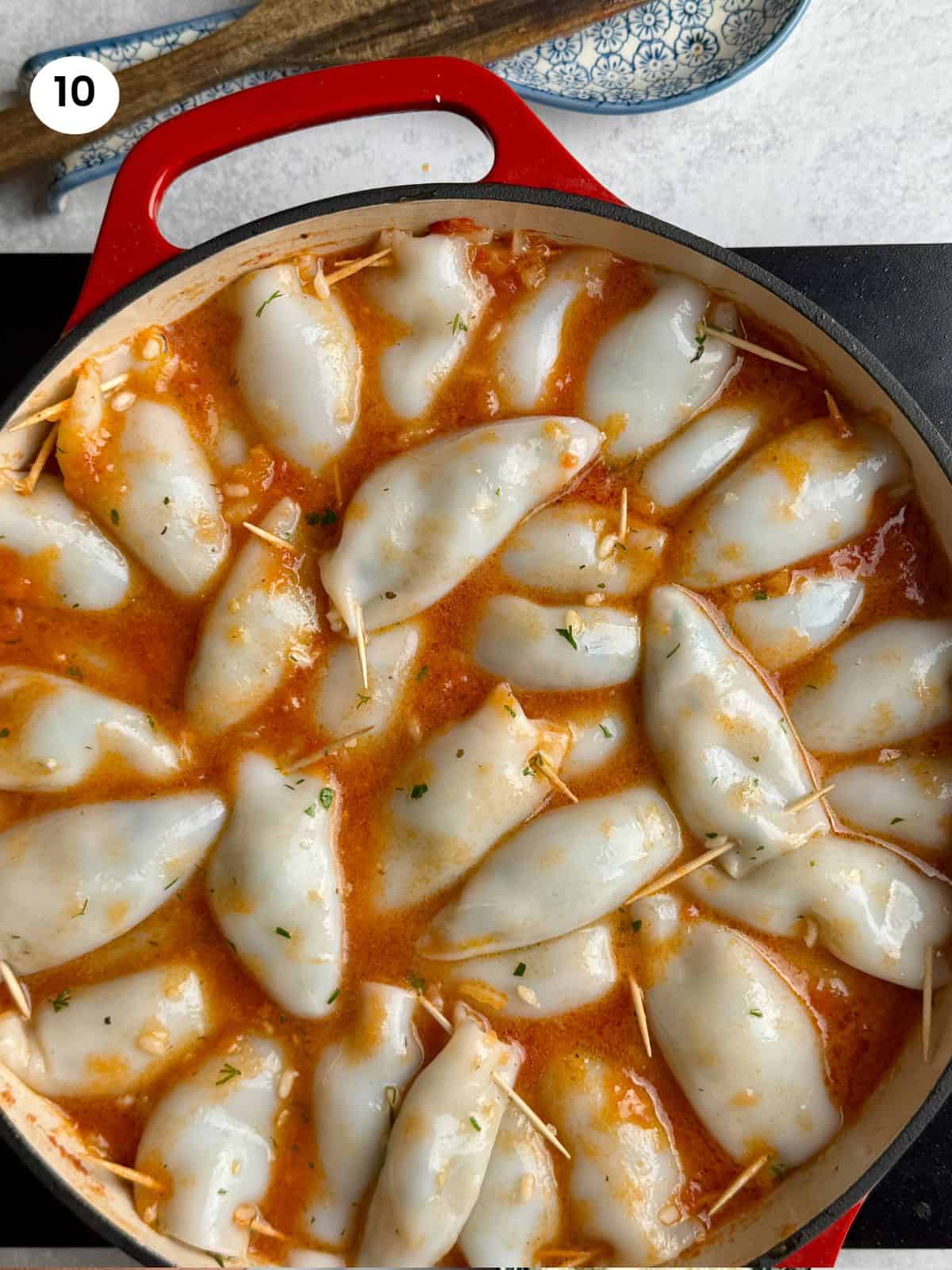 Stuffed calamari in tomato sauce ready for the oven.