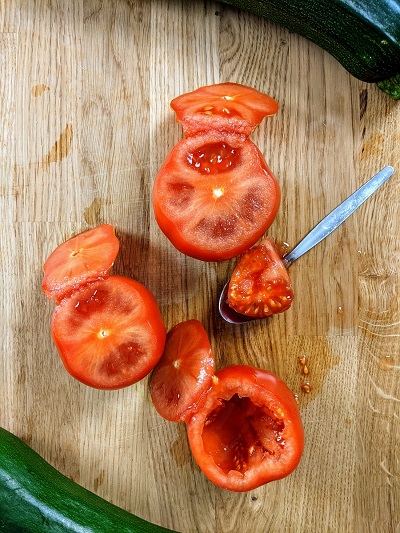 Cut the top from the tomatoes to stuff them.