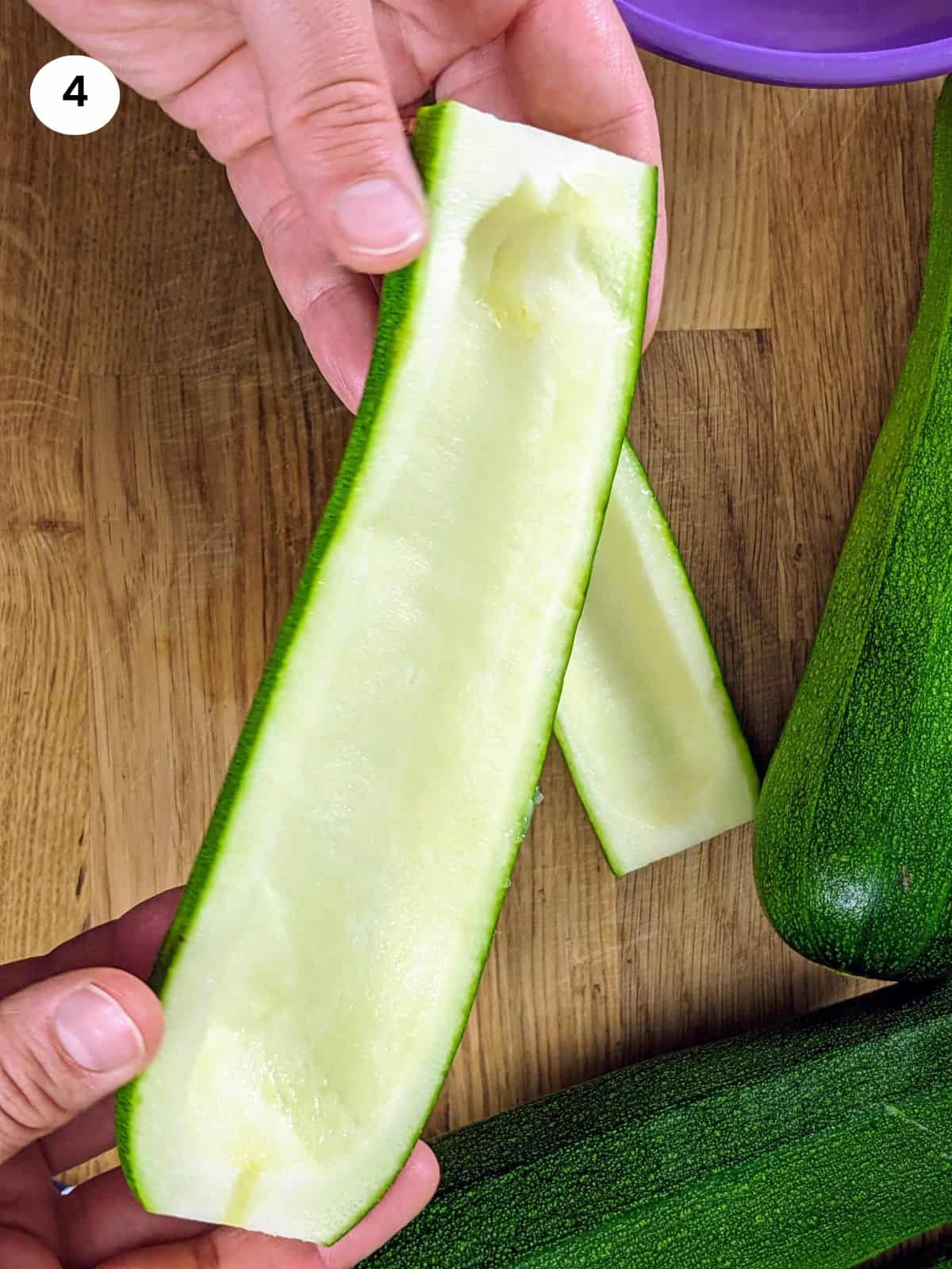 Removing the flesh from the zucchini