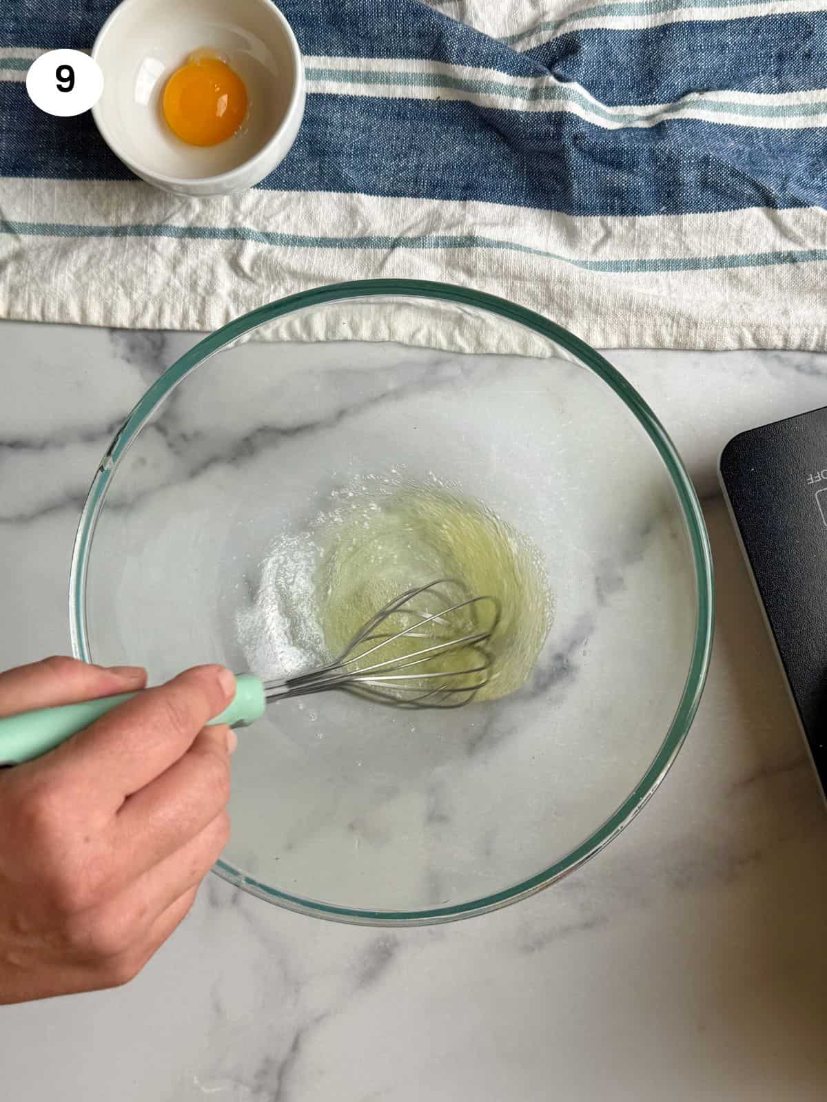 Whisking the egg whites until foamy.