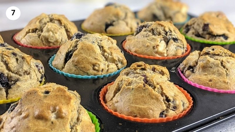 Sugar free blackberry muffins out of the oven in a muffin tin.