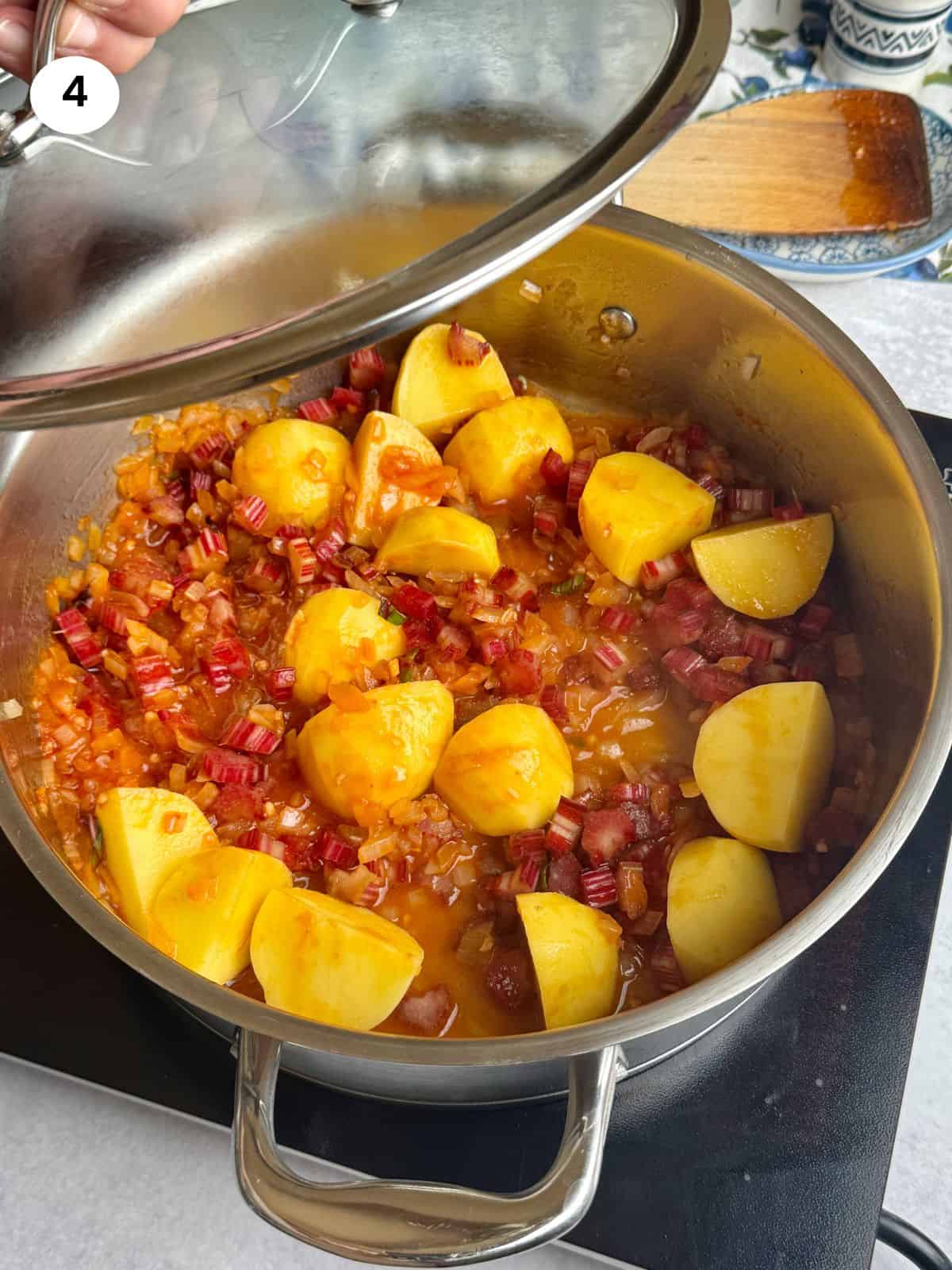 Added potatoes and chard stalks to the pot.