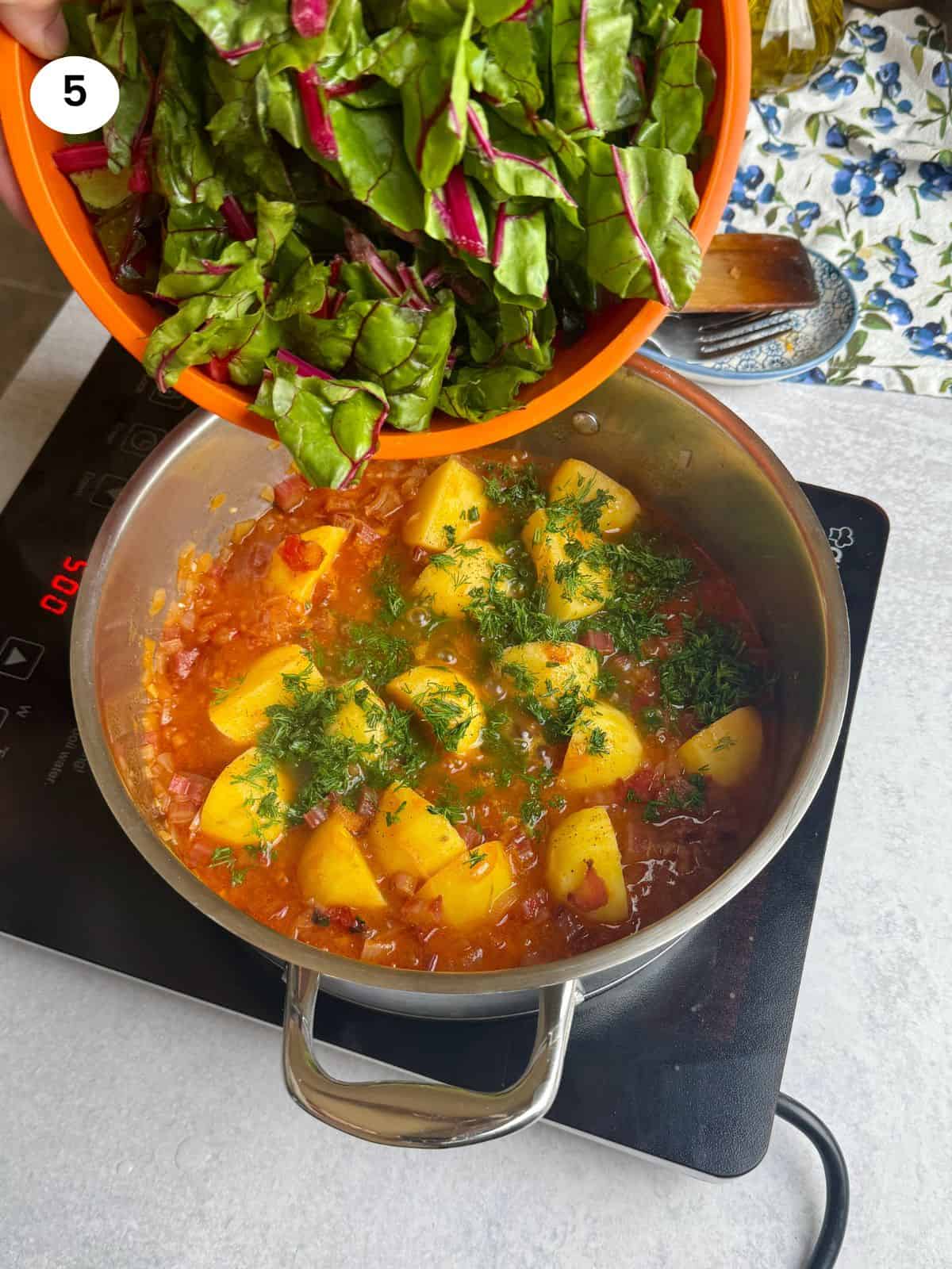 Adding the swiss chard leaves.