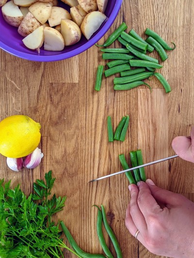 Cutting green beans for swiss chard salad.