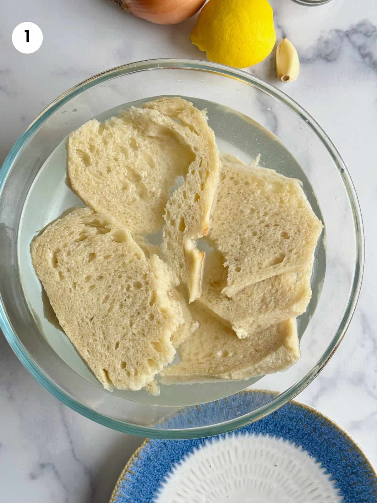 Soaking bread in a bowl filled with water.