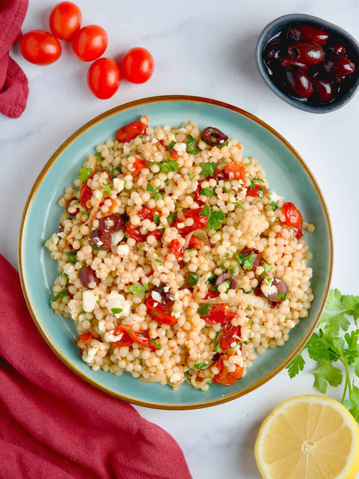 Pearl Couscous With Olives And Roasted Tomatoes Salad.