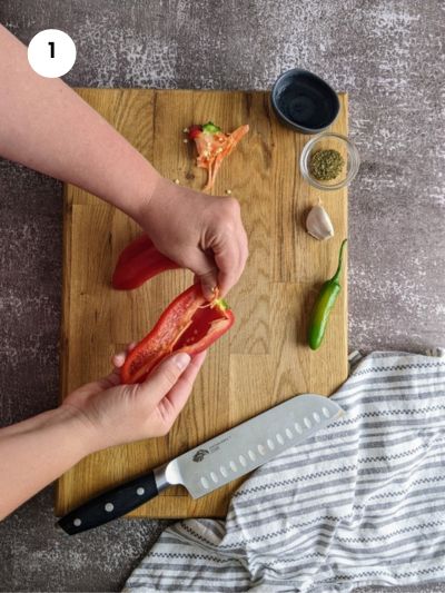 Removing the seeds from the peppers.