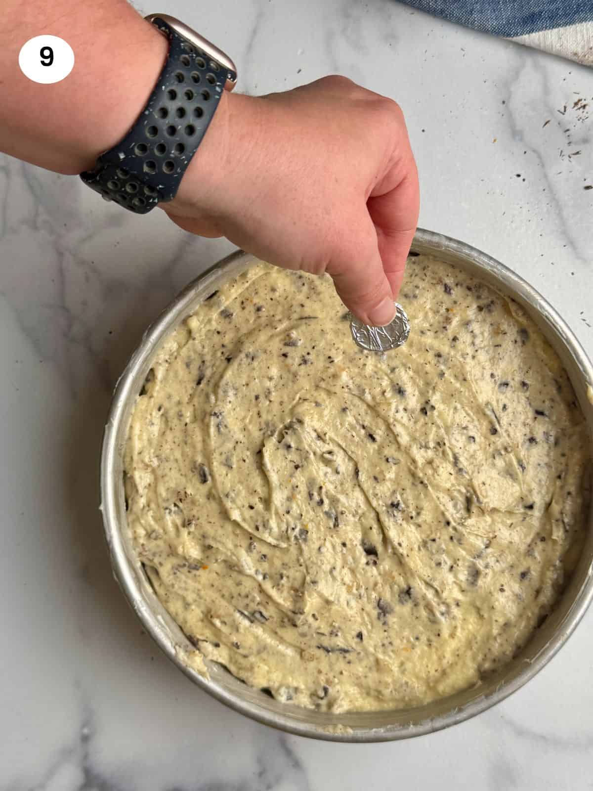 Adding a coin wrapped in foil.