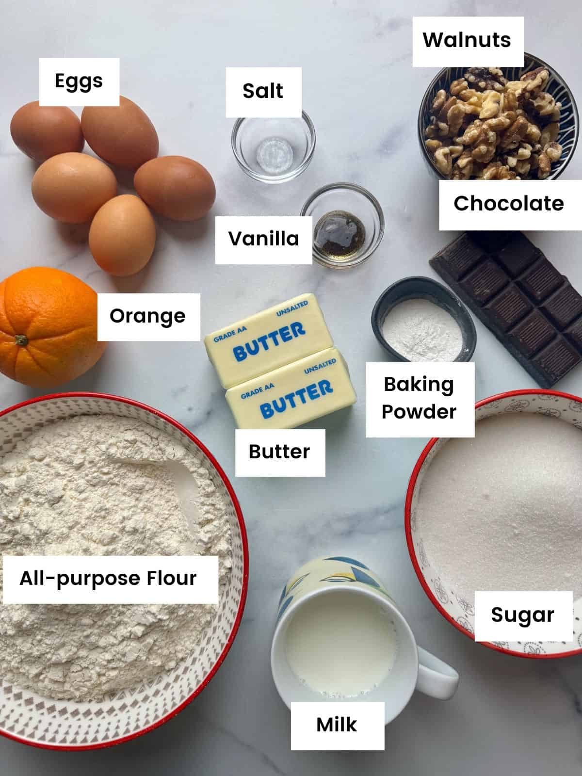 Ingredients for vasilopita cake with chocolate and walnuts.