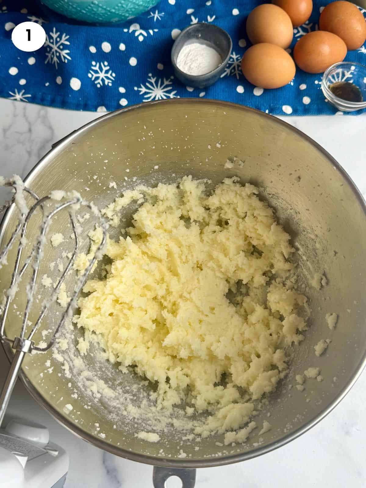 Mixing the butter and sugar until fluffy.