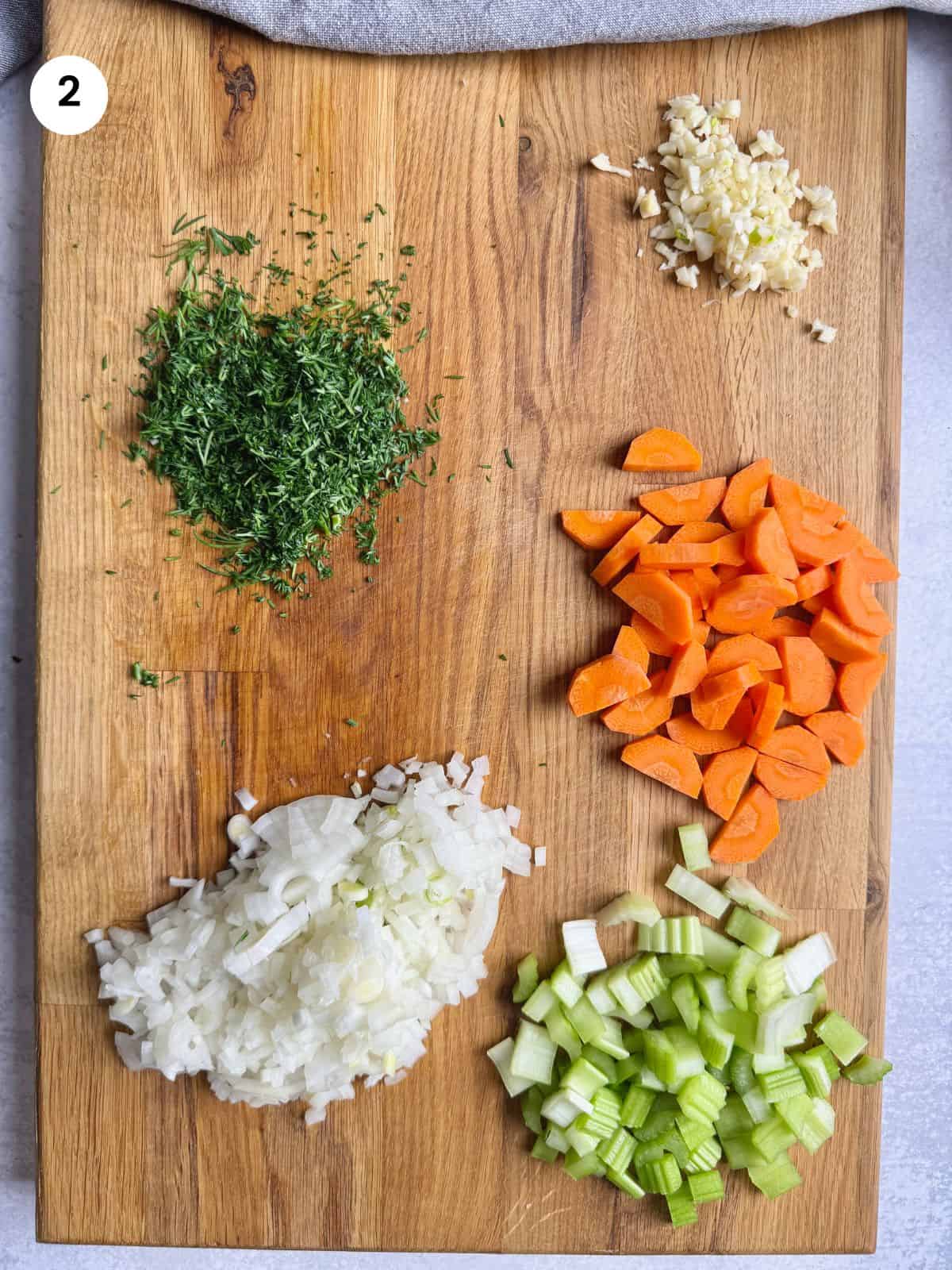 Chopped vegetables on a wooden board.