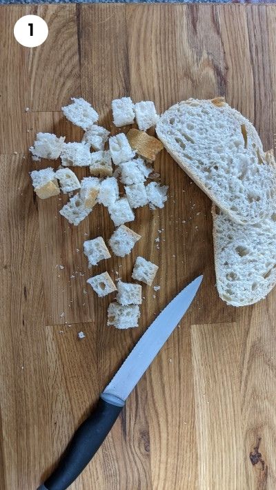 Cutting the bread slices into cubes