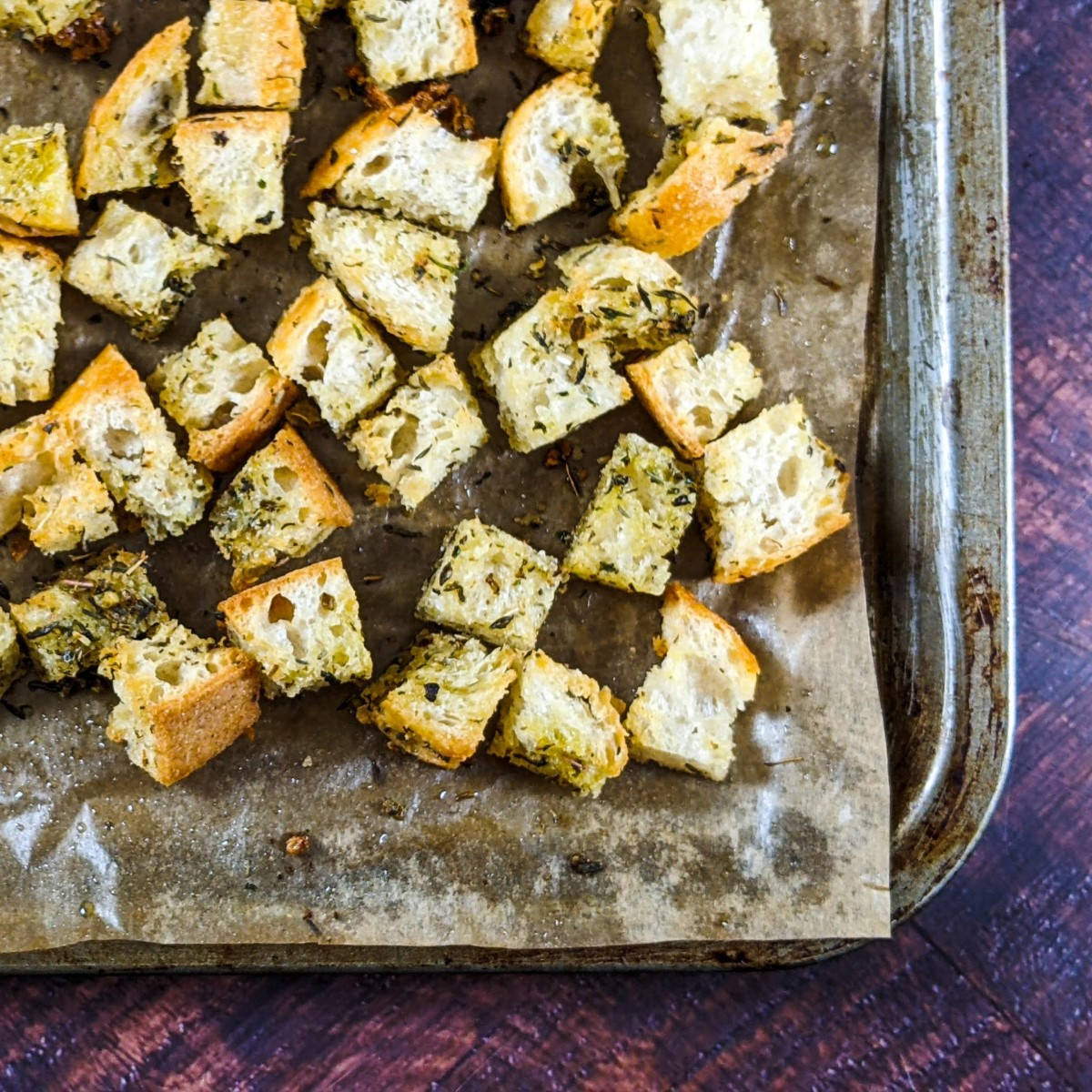 Homemade vegan croutons on a tray.