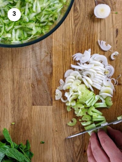 Chopping the leek for the crustless zucchini pie.