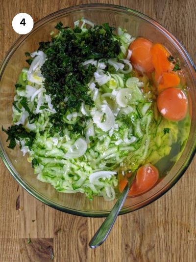 Adding the eggs to the bowl.