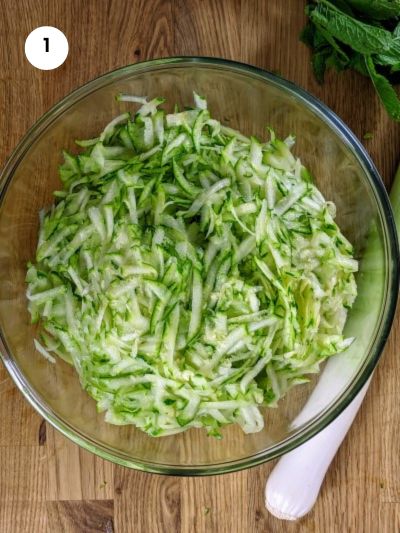 Grated zucchinis ready for the batzina.